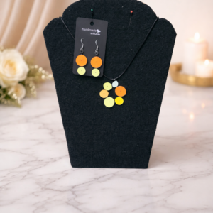 Circular-style earrings and necklace set showcasing warm, elegant orange and yellow tones.