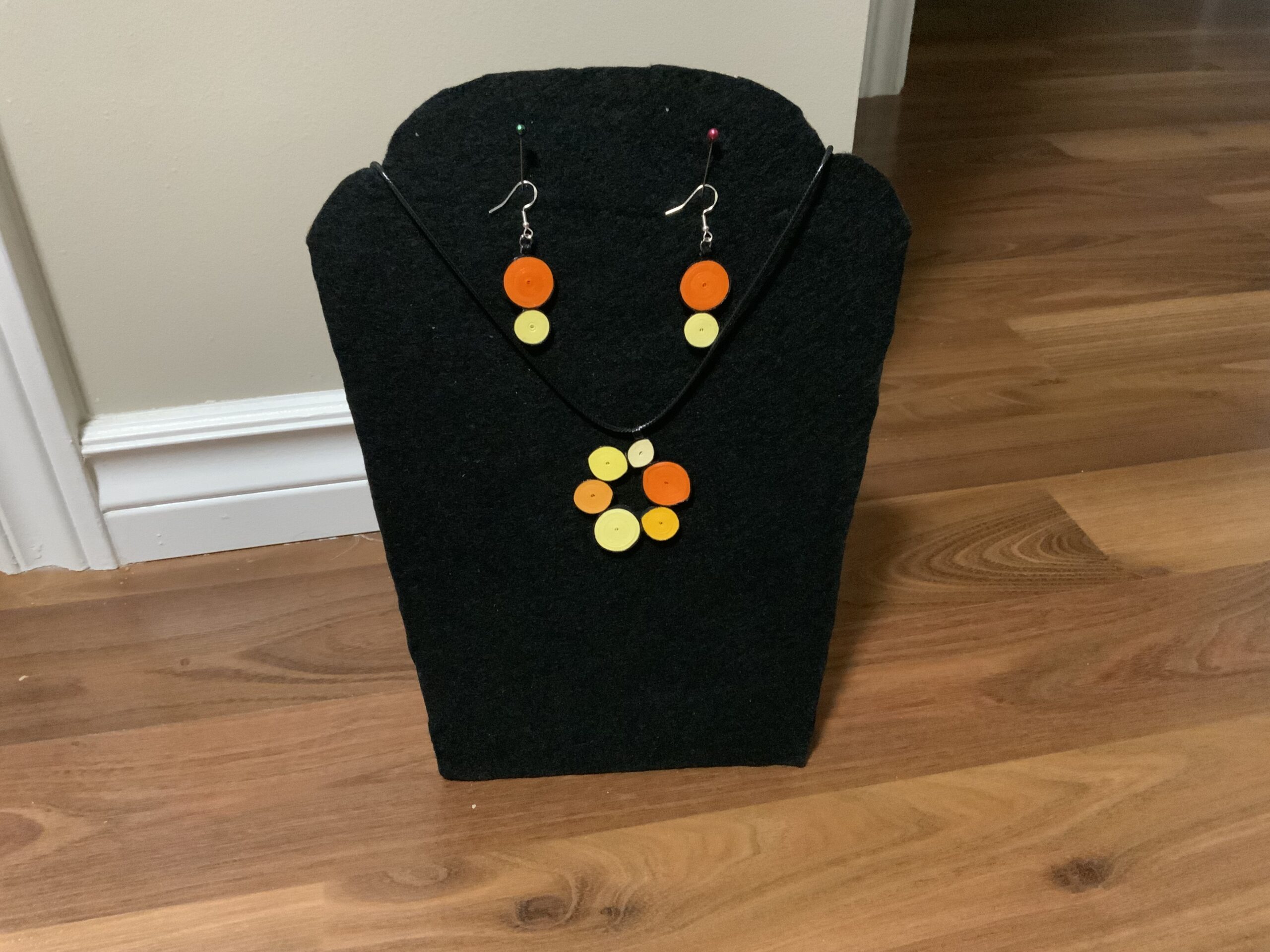 Circular-style earrings and necklace set showcasing warm, elegant orange and yellow tones. - Image 9