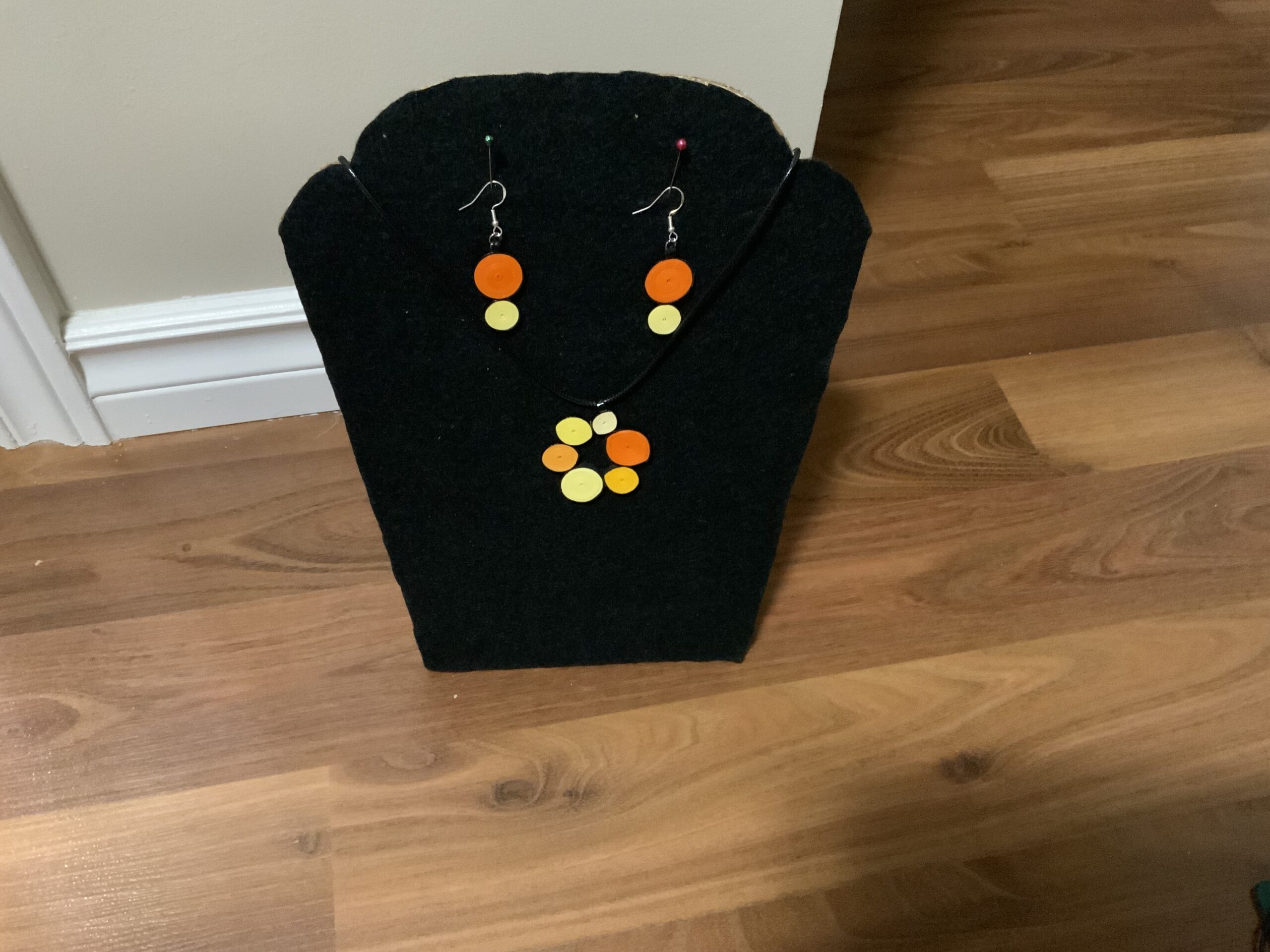 Circular-style earrings and necklace set showcasing warm, elegant orange and yellow tones. - Image 4